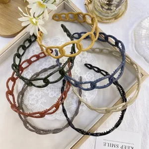 Collection of colorful candy-colored plastic chain headbands with anti-slip grip teeth