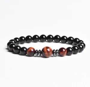 Close-up detail of the beaded bracelet showing polished black and red tiger eye beads.