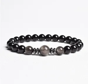 Detailed view of an 8mm black beaded gemstone bracelet with metallic spacers for daily wear.
