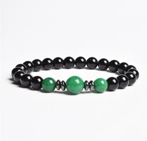 Detailed view of 8mm black and green stone beaded bracelet with elegant metal spacers.