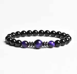 Exquisite beaded bracelet detail featuring purple chatoyant stones and dark obsidian beads.