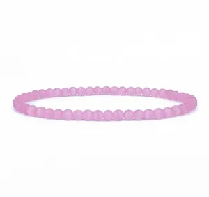 Detailed view of a delicate pink cat eye stone bead bracelet, 4mm daily wear jewelry.