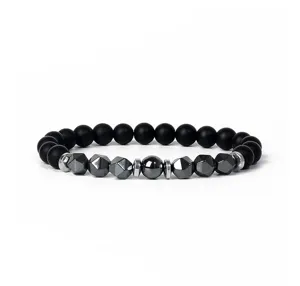 Detailed shot of the black matte beaded bracelet with faceted metallic center stones.