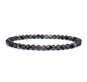 Close-up detail of 4mm natural stone beaded bracelet, single strand elastic yoga jewelry.