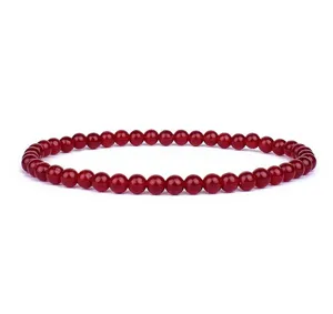 Red stone bead bracelet detail view showing uniform 4mm round beads and smooth polish finish.