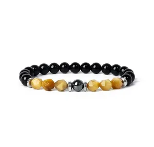 Close-up detail of the faceted tiger eye and black bead bracelet, showing exquisite texture.