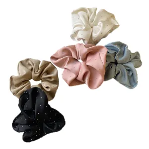 Set of elegant rhinestone studded scrunchies in multiple colors for hair styling