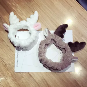 Cute plush deer antler headbands in white and brown for face washing and makeup.