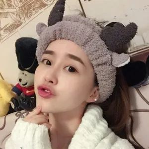 Adorable plush grey headband with cute black deer horns for makeup and face washing