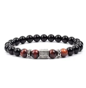 Close up of beaded bracelet detail featuring black and red tiger eye stones with cubic zirconia.
