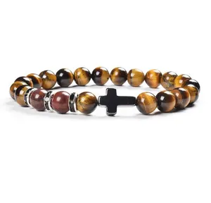 Detail shot of the 8mm yellow tiger eye stone and black cross beaded bracelet piece.