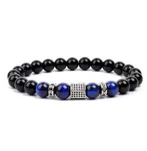 Stylish beaded bracelet featuring blue tiger eye beads and black stones with cubic zirconia pavé.