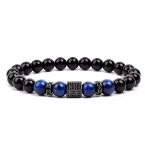 Detailed view of men women beaded bracelet featuring blue tiger eye and paved zircon charm.