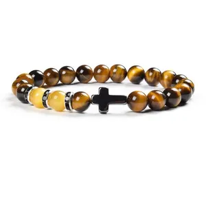 Detailed close-up view of 8mm yellow tiger eye stone cross chalcedony beaded bracelet