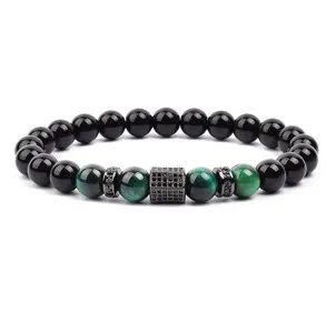 Close up detail view of green tiger eye stone beaded bracelet with cubic zirconia charms.