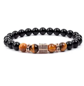 Close-up detail view of 8mm natural tiger eye gemstone and micro pave zircon bead bracelet.