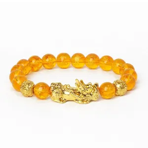 Bracelet porte-bonheur Pi Xiu doré avec perles couleur ambre pour la richesse et chance.