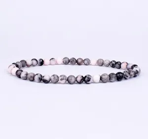 Detailed shot of 4mm natural stone beaded bracelet highlighting smooth round bead textures.