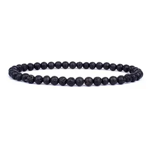 Black lava stone beaded detail shot showing porous texture of 4mm round yoga bracelet.