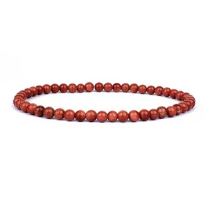 Close-up detail of 4mm sparkling gold sandstone beaded bracelet, exquisite craftsmanship.