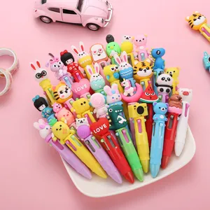 Close-up of cute cartoon 4-color press ballpoint pens with various animal toppers in a plate.