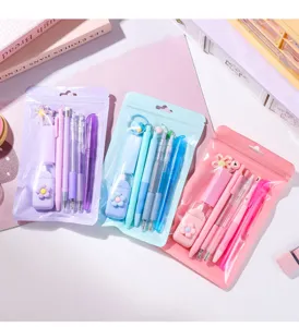 Macaron stationery set detail showing colorful pens, correction tapes and cute pouches.