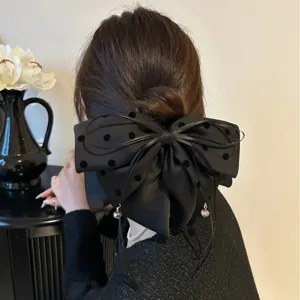 Grande pince à cheveux nœud noir à pois pour coiffures élégantes chignons bas