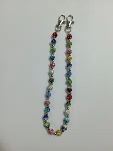 Detailed shot of colorful rhinestone clay disco ball chain with metal lobster clasps for accessories.