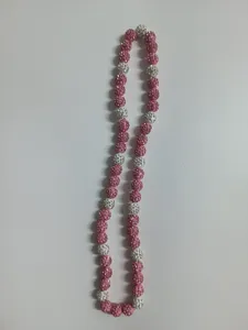 Close-up detail of a Shamballa necklace featuring pink and white rhinestone beads.