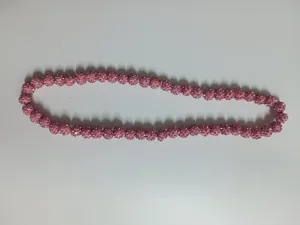 Detailed view of a pink Shamballa necklace featuring glittering rhinestone clay beads