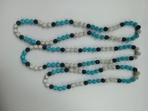 Close-up of 10mm shamballa rhinestone clay bead necklace in teal, black and silver.