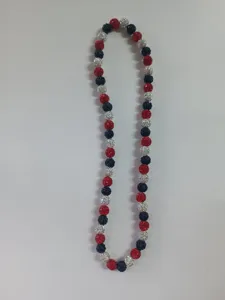 Detailed view of 10mm red white and blue Shamballa disco ball beaded clay necklace.