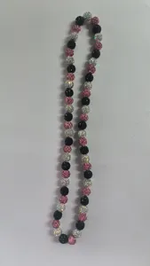 Detailed macro view of 10mm pink, black and AB white rhinestone Shamballa bead necklace