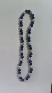 Detailed view of 10mm Shamballa disco beads in blue, black and AB white finish