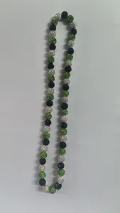Detailed view of 10mm green black and white rhinestone disco ball beads necklace