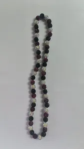 Close-up of 10mm Shamballa disco ball beads necklace in black red and white.