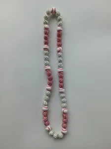 Close-up detail of a baseball theme Shamballa necklace featuring pink and silver beads.