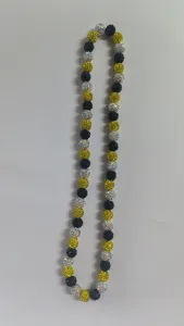 Detailed macro view showing the textured crystal clay beads of the Shamballa necklace