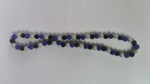 Close-up view of 10mm blue, black and silver Shamballa pavé disco ball bead strand