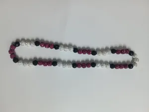 Detailed macro view of 10mm rhinestone Shamballa beads in black, white, and magenta