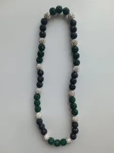 Detailed view of Shamballa necklace with black, green, and silver rhinestone clay beads