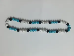 Detail view of 10mm shamballa beads necklace with blue black and white crystals