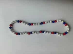 Detailed view of red white and blue Shamballa rhinestone beads on elastic necklace