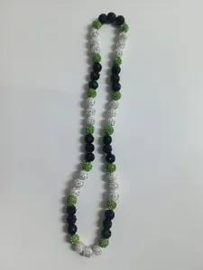 Close-up of 10mm Shamballa disco ball beaded necklace with green black and white crystals