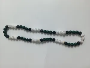 Close-up detail of 10mm dark green and AB white rhinestone disco ball bead necklace