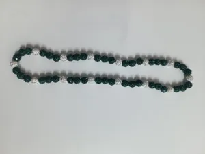 Close-up of 10mm dark green and crystal rhinestone Shamballa beaded necklace detail.