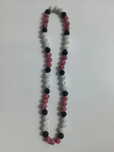 Close-up of 10mm Shamballa disco bead necklace in pink, black, and AB white finish.