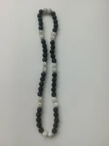 Detailed view of the 10mm black and white rhinestone Shamballa clay bead necklace set
