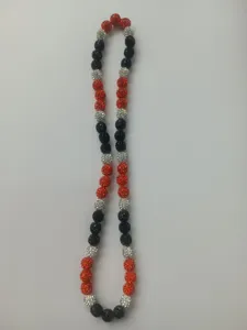 Close-up view showing the detail of 10mm red, black and silver rhinestone beads on necklace