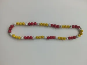 Detailed view of a 10mm disco ball pavé bead necklace in red, yellow, and white colors